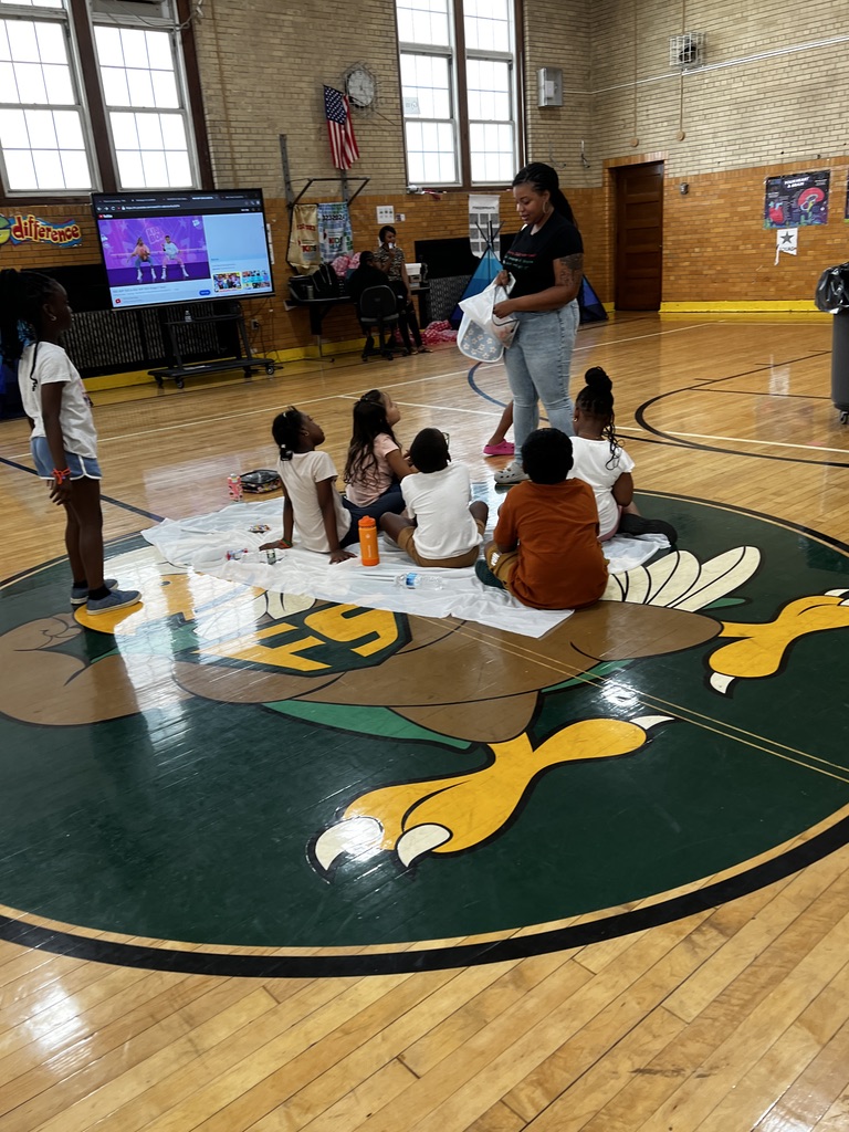 Summer camp enrichment session in the school gym