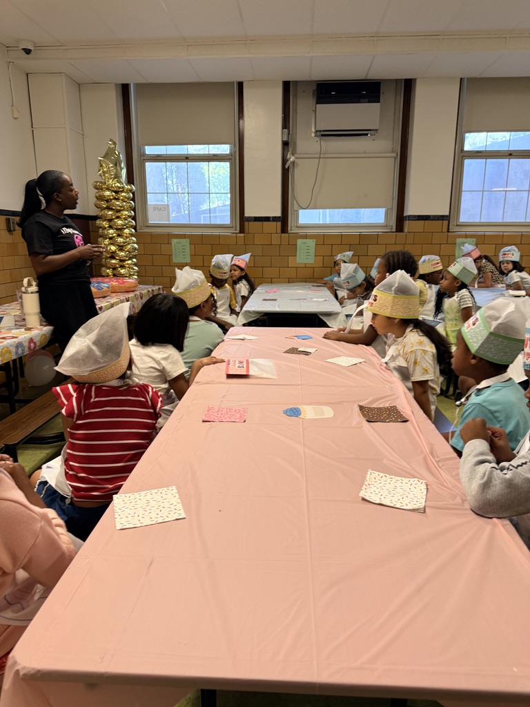 Leading a student workshop at the summer camp café